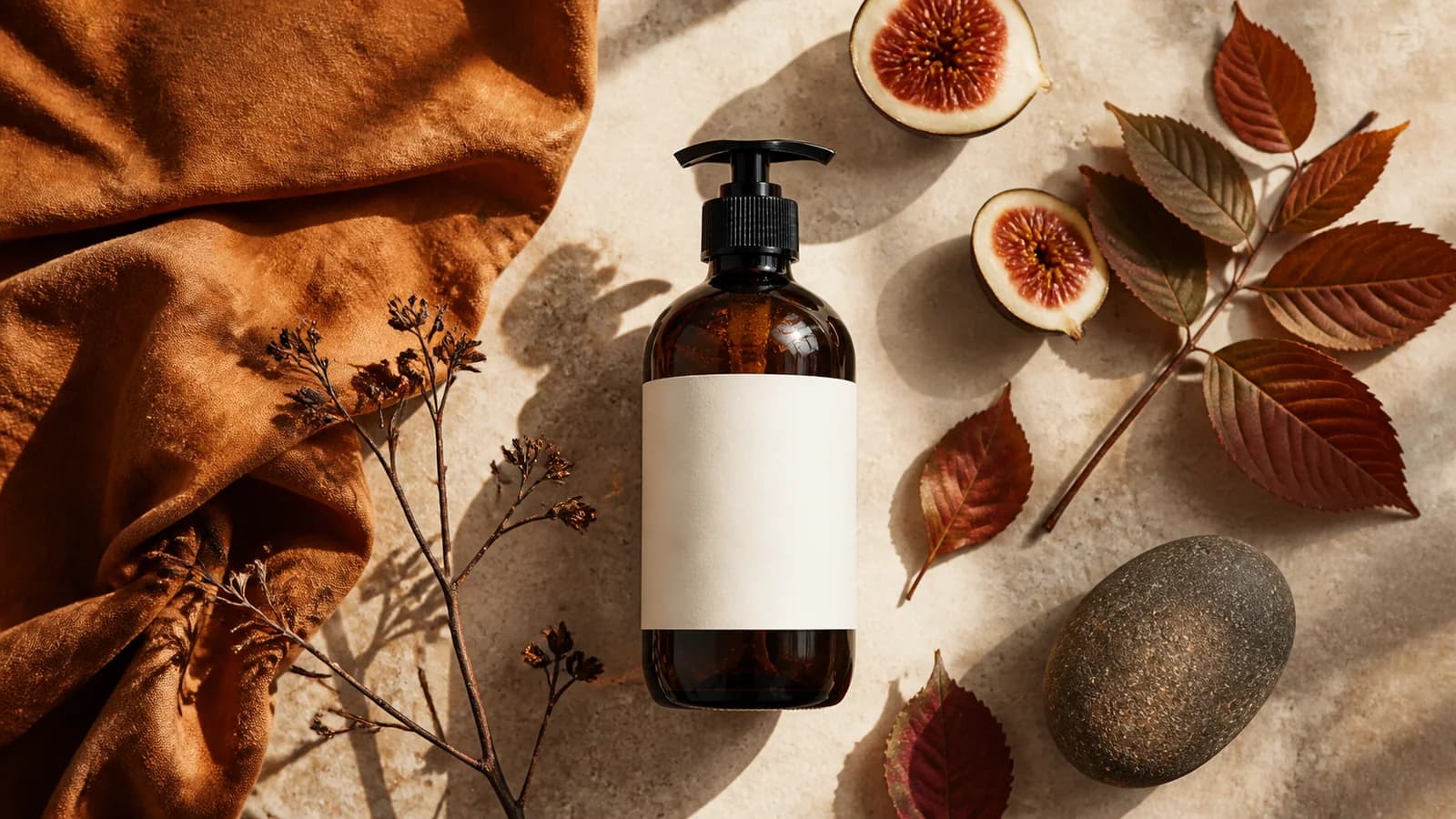 Amber soap bottle restyled as an autumn botanical flat lay