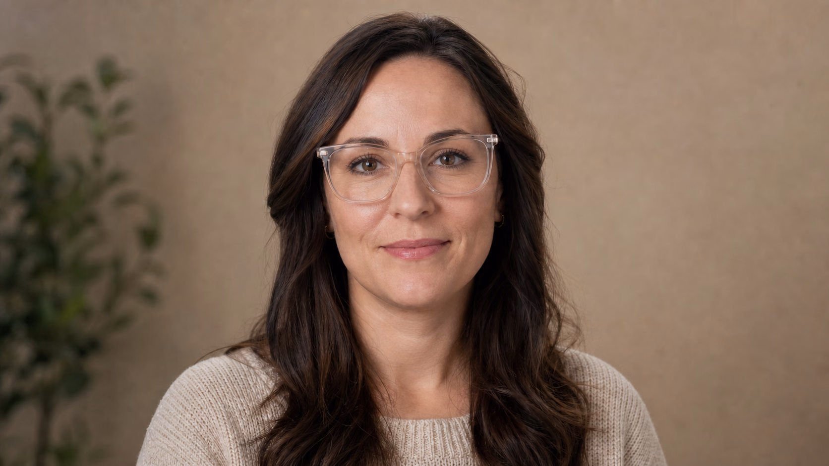 Portrait of a woman wearing clear eyeglasses after blue-white lens glare is removed and both eyes are visible